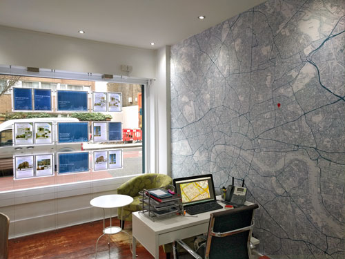 estate agent office with local wallpaper map